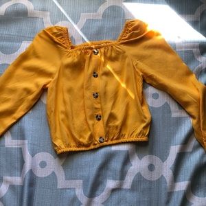 This is a yellow H&M crop top. Barely worn.